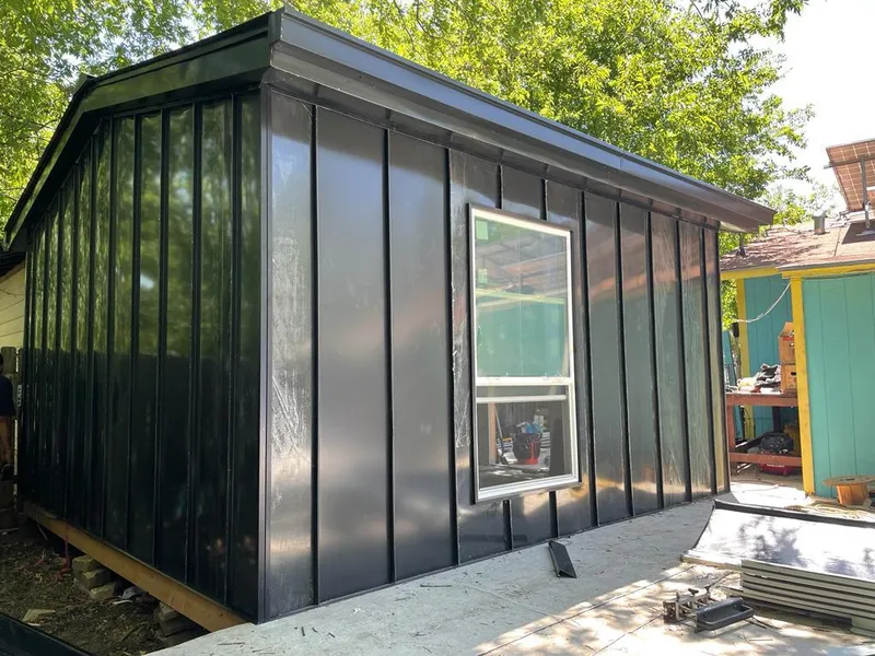 Black standing seam metal wall panels for Roof Inspection in Melrose