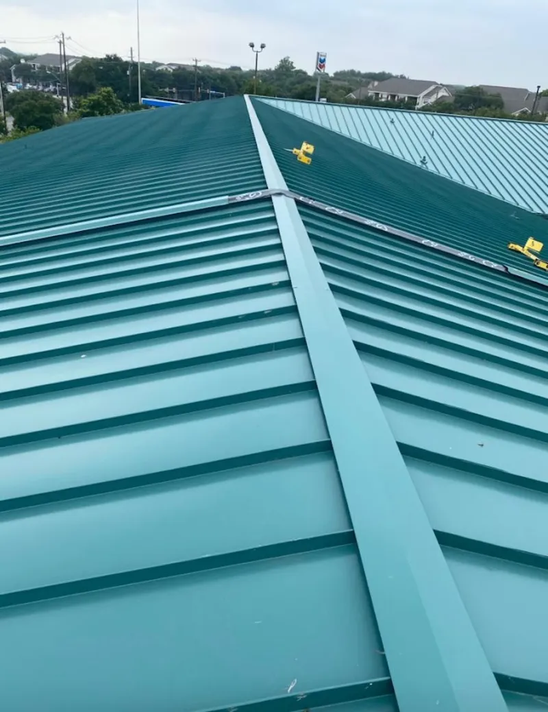 Green commercial metal roof ridge and valley for Metal Roof Repair in Melrose